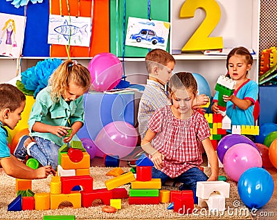 Group children game blocks on floor Stock Photo