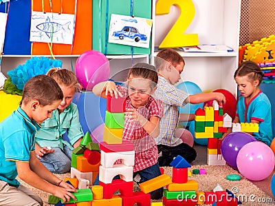 Group children game blocks on floor Stock Photo