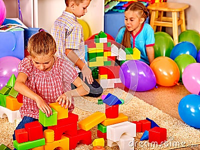 Group children game blocks on floor . Stock Photo