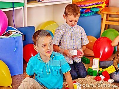 Group children game blocks on floor . Stock Photo