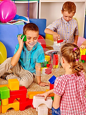 Group children game blocks on floor . Stock Photo