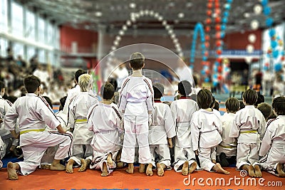 A group of children in kimono. Watch a demonstration performance of karate masters Editorial Stock Photo