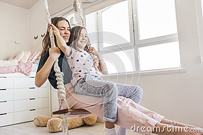 Kids paljamas party in white bedroom interior Stock Photo