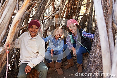 Group Of Children Playing In Forest Camp Together Stock Photo