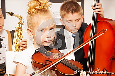 Group of children playing musical instruments Stock Photo