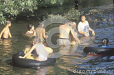 A group children swimming in a river near Ojai, CA Editorial Stock Photo