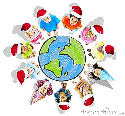 Group of Children Wearing Christmas Hats with Globe Stock Photo