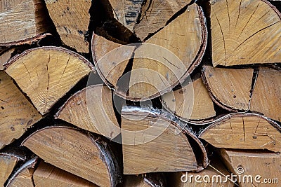 Group chopped logs pile of firewood background rustic close-up design cracked light beige Stock Photo