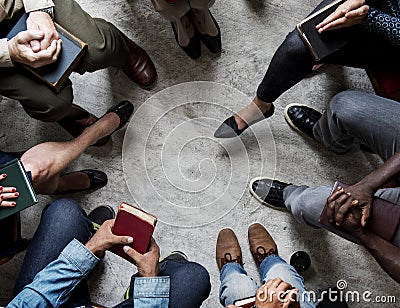 Group of christianity people sitting reading bible together Stock Photo