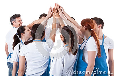 Group of cleaners making high five gesture Stock Photo