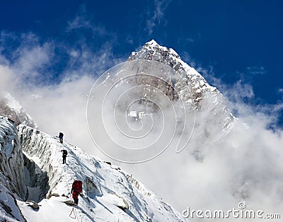 Group of climbers on mountains montage to mount Lhotse Stock Photo