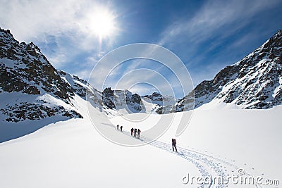 Group of climbers roped to the summit Stock Photo