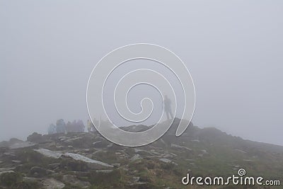 Group of climbers standing at the top of the mountain Editorial Stock Photo