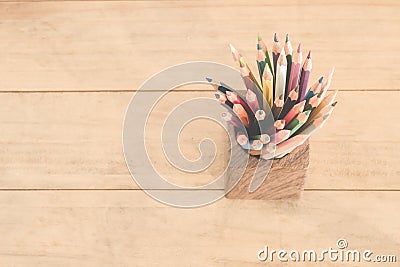 Group of color pencils in a wood cup . Stock Photo