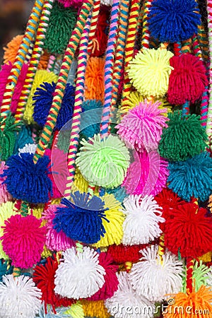 Group of colored Peruvian tassels for sale at the Cusco market. Stock Photo