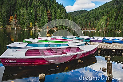 Group of colorful boats parked on a pier in Piatra Neamt, Romania Editorial Stock Photo