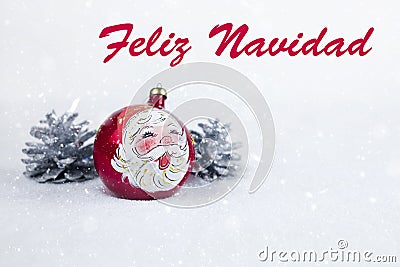 Group of colorful Christmas ball with drawing of Santa Claus and pines with text in Spanish `Feliz Navidad` Stock Photo