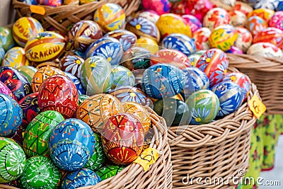 Group of colorful handmade Easter eggs in a few baskets, set of handcrafted traditional Polish pisanki, group of objects, detail Editorial Stock Photo