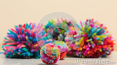 Group of colourful hand made wool pom poms Stock Photo