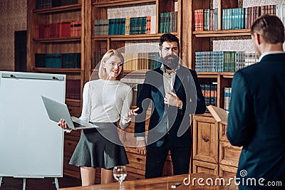 Group concept. Group of young business people work and communicate together. Group of students in university library Stock Photo