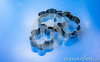 Group of cookie cutters isolated on blue Stock Photo