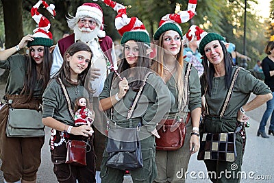 Group of Cosplayers dressed as Santa Claus and Elves at the Lucca Comics and Games 2022 cosplay event. Editorial Stock Photo