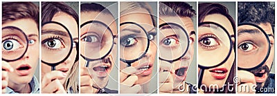 Group of curious women and men looking through a magnifying glass Stock Photo