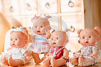 Group of cute baby dolls on bright background Stock Photo