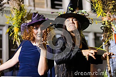 Group of cute and scary witches at NYC Village Halloween parade Editorial Stock Photo