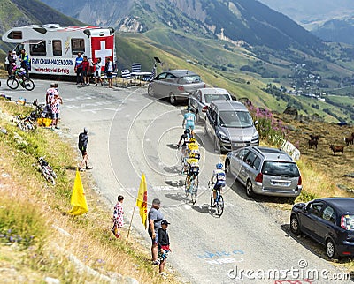 Group of Cyclists on the Mountains Roads - Tour de France 2015 Editorial Stock Photo