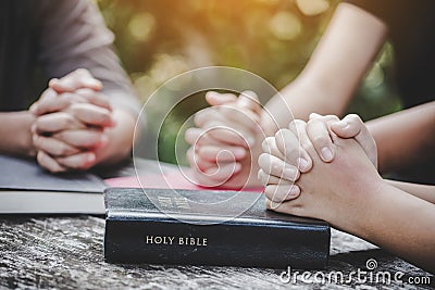 Group of different women praying together Stock Photo