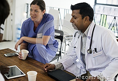 Group of diverse doctors are having a discussion Stock Photo