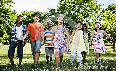 Group of diverse kids having fun together in the park Stock Photo