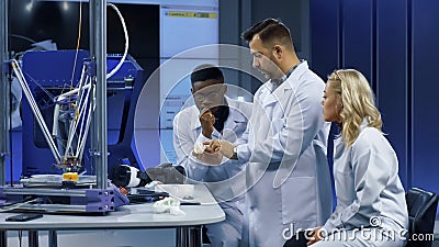 Scientists exploring 3-D printing technologies Stock Photo