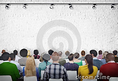 Group of Diverse People Facing White Brick Wall Stock Photo