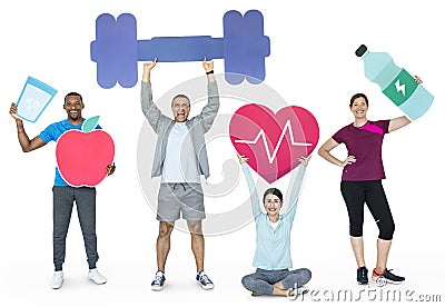 Group of diverse people holding health and fitness icons Stock Photo