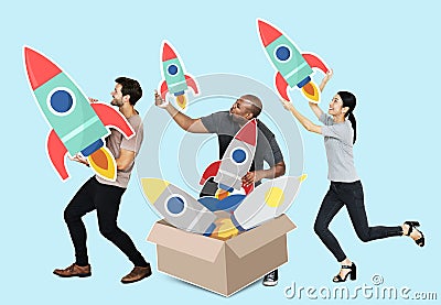 Group of diverse people with rockets in a box Stock Photo