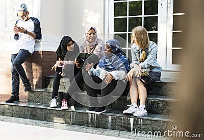 A group of diverse teenagers having conversation Stock Photo