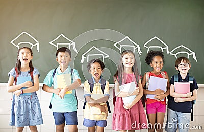 Diverse young students standing together in classroom Stock Photo