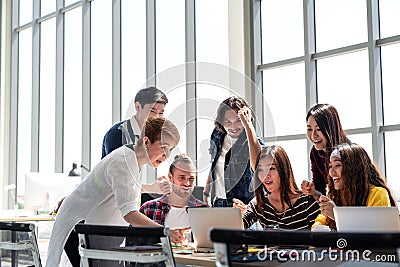 Group of Diversity People Team smiling and excited in success work with laptop at modern office. Stock Photo