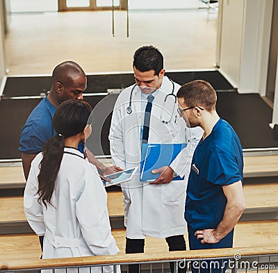 Group of doctors in an impromptu meeting Stock Photo