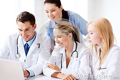 Group of doctors looking at tablet pc Stock Photo