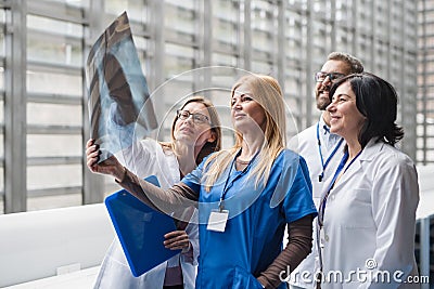 Group of doctors talking about corona virus on conference. Stock Photo