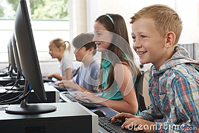 Group Of Elementary School Children In Computer Class Stock Photo