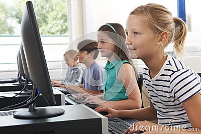 Group Of Elementary School Children In Computer Class Stock Photo