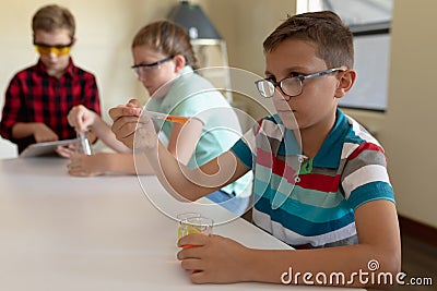 Group of elementary school kids in chemistry class Stock Photo