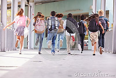 Group of elementary school kids running at school, back view Stock Photo