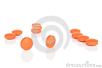 Orange pharmacy tablet isolated on white Stock Photo