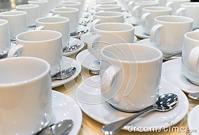 Group of empty coffee cups. Many rows of white cup for service tea or coffee in breakfast Stock Photo