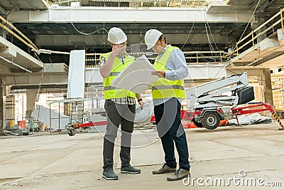 Group of engineers, builders, architects on the building site. Construction, development, teamwork and people concept Stock Photo